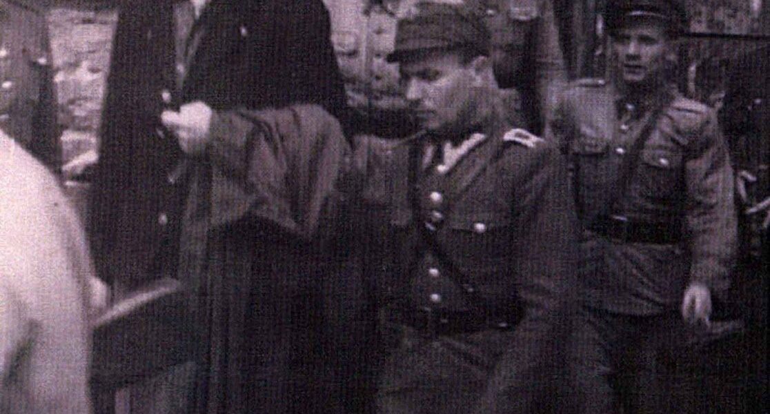 Camp Commandant Amon Goeth, infamous from the movie “Schindler’s List”, standing on his balcony preparing to shoot prisoners, 1943