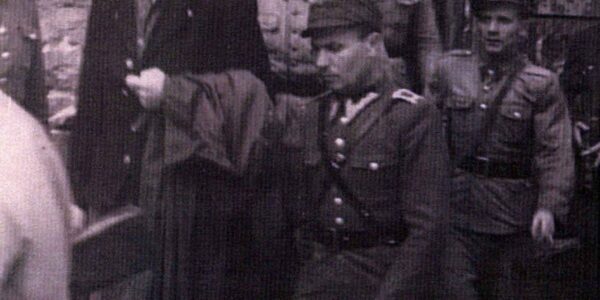 Camp Commandant Amon Goeth, infamous from the movie “Schindler’s List”, standing on his balcony preparing to shoot prisoners, 1943